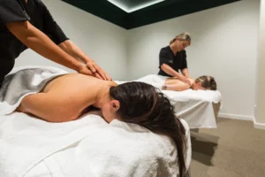 Massage at Lovoir — a therapist giving a client a full body massage