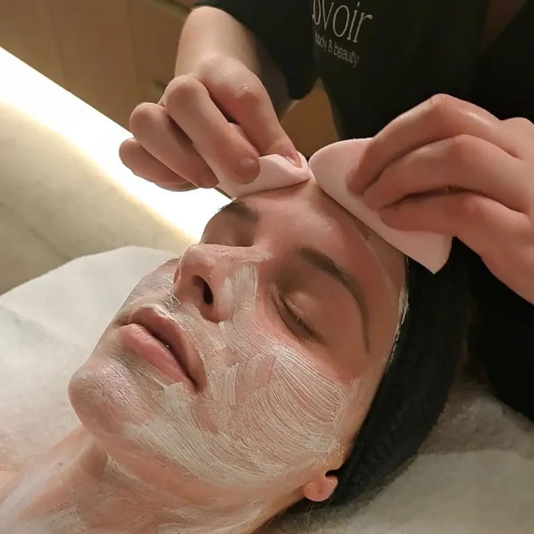 Chemical Peel at Lovoir — a therapist giving a client a chemical peel
