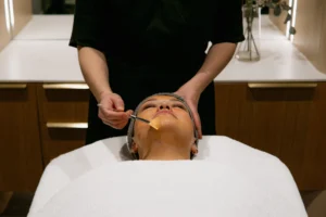 Facials at Lovoir — a therapist giving a client a facial treatment